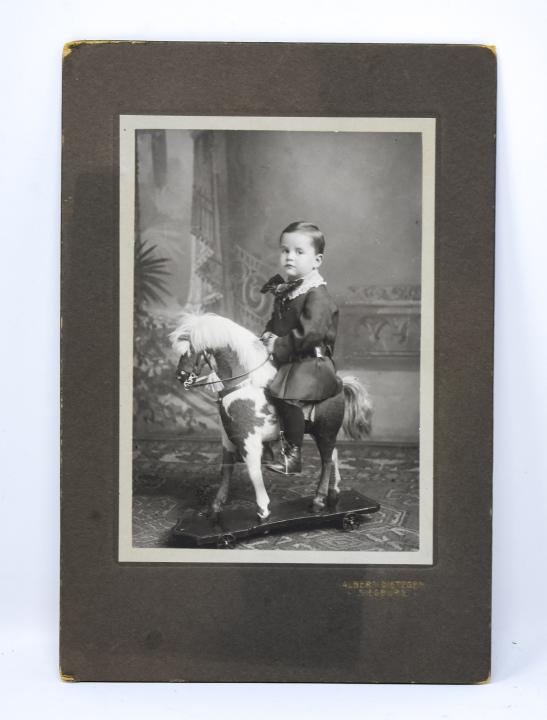 Antique 19th C Photograph of Boy on Toy Horse: Antique 19th C Photograph of Boy on Toy Horse. Measures 8.75 x 6 inches.