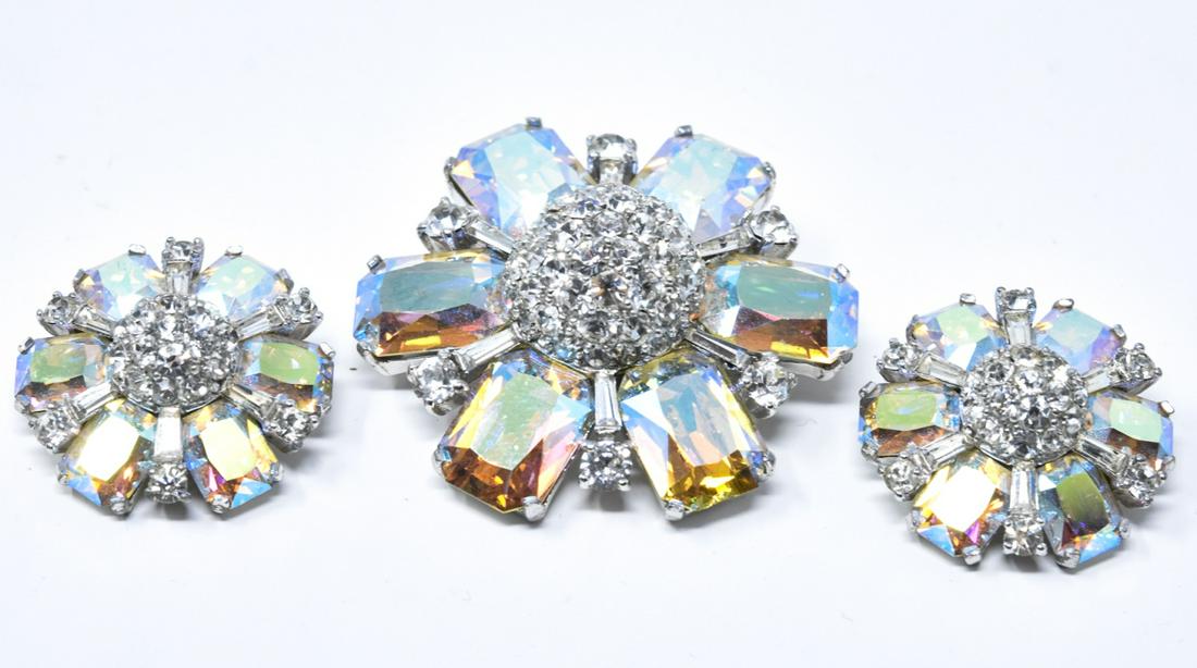 Vintage Jomaz Costume Jewelry Rhinestone Parure: Vintage Jomaz Costume Jewelry Rhinestone Parure. Brooch and clip on earrings. Signed on earring back. Rhodium plated, iridescent rhinestones. Brooch measures nearly 2 inches in diameter.