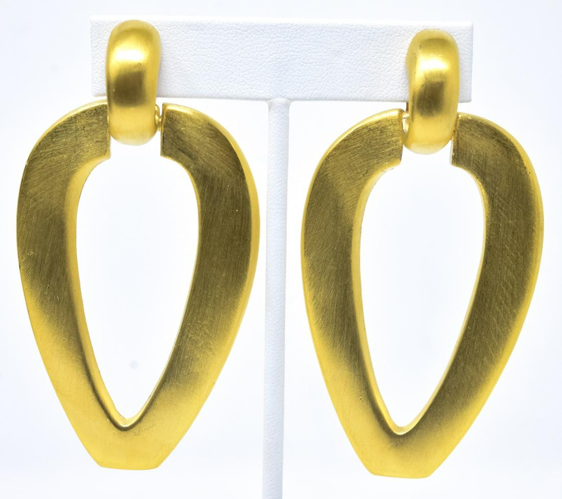 Pair Vintage C 1980 Gilt Alexis Kirk Clip Earrings: Pair Large Scale Costume Jewelry Vintage C 1980s Gilt Alexis Kirk Clip Earrings. With original tag. Signed. Inverted pear shape with satin gilt finish. Each measures 3 inches in length.