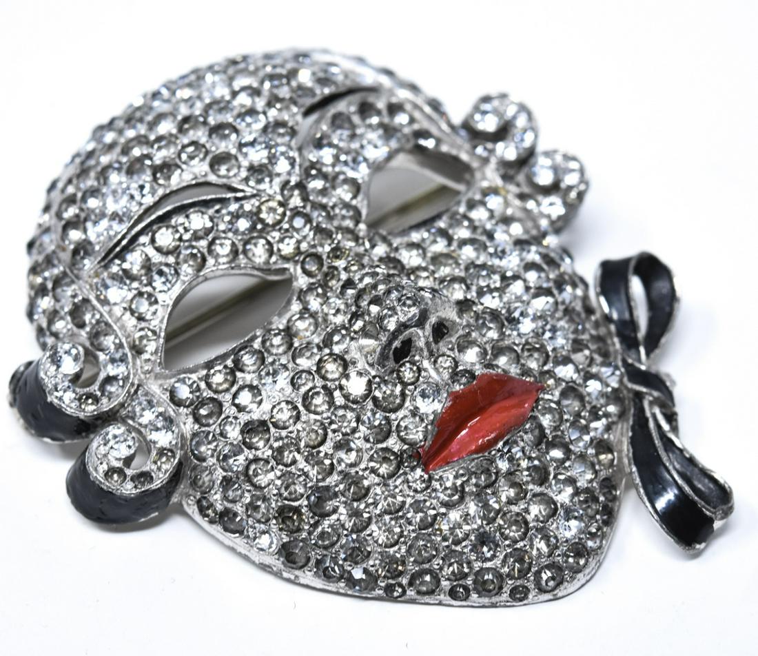 Vintage C 1930s Paste Set Mask Motif Brooch: Vintage C 1930s Paste Set Mask Motif Brooch. Unsigned but likely by Mazer. Measures just over 2 inches in length. Featuring painted enamel details including lips and ribbons. Brooch but converted from