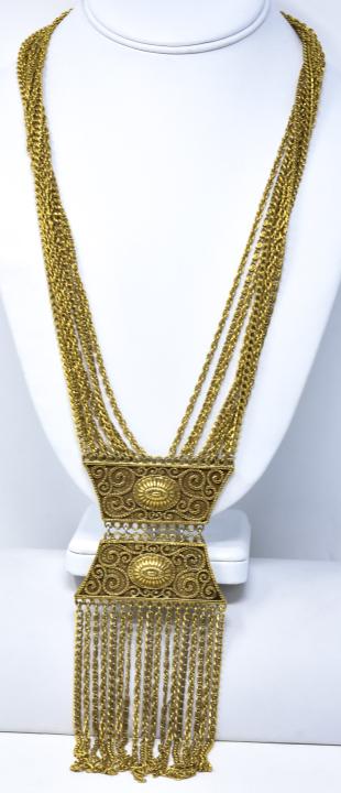 Vintage 8 Strand Gilt Metal Mughal Style Necklace: Vintage 8 Strand Gilt Metal Mughal Style Necklace. Attributed to Goldette. Measures 24.5 inches in length plus articulated & fringed pendant drop.