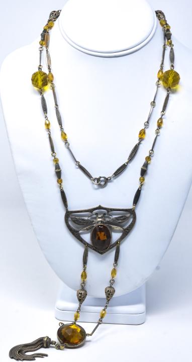 Antique C 1910 Art Nouveau Bumble Bee Necklace: Antique C 1910 Art Nouveau Bumble Bee Necklace. Silver tone metal with faceted citrine glass crystals. Pendant with extended drop and tassel, bee motif insect at center. Measures 40 inches in length p