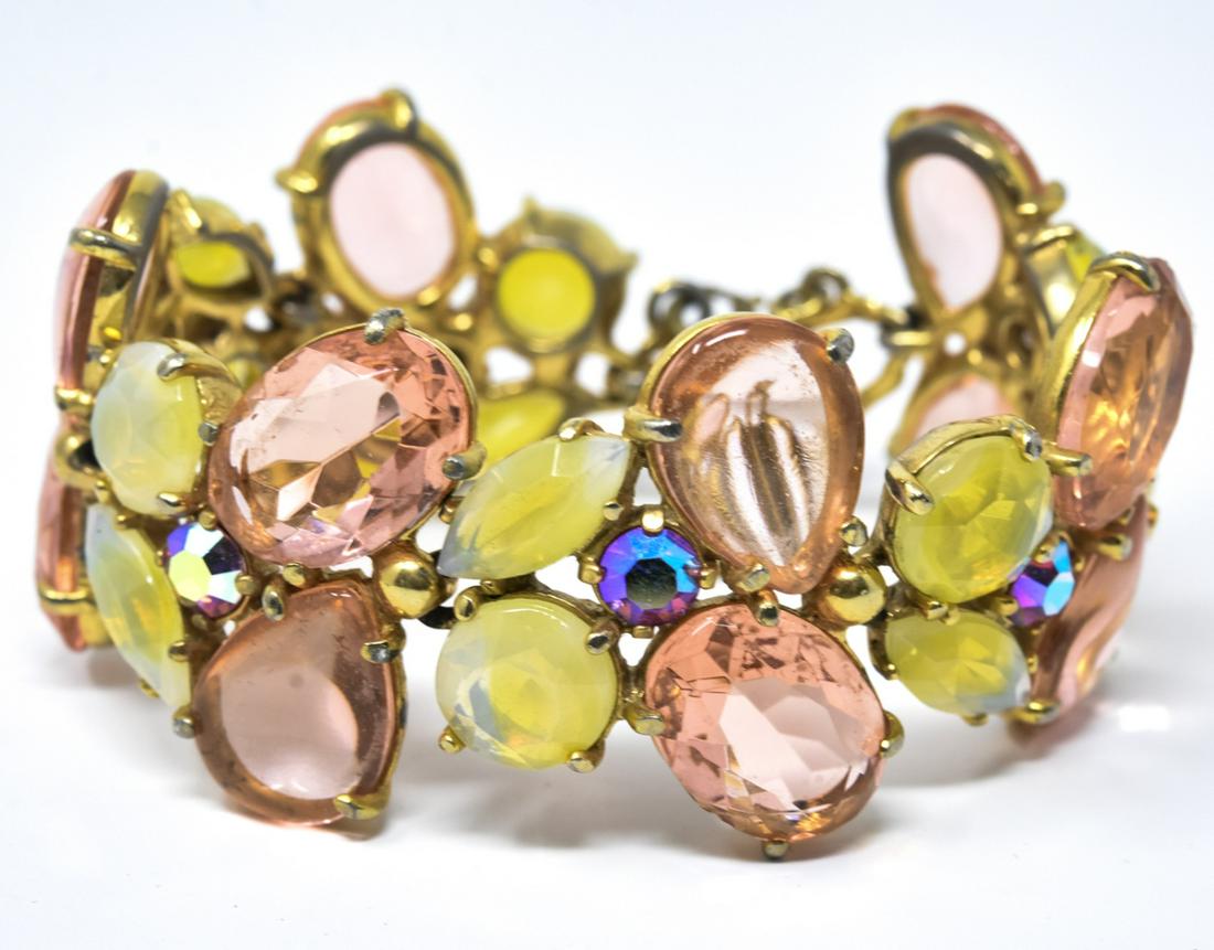 Vintage Elsa Schiaparelli C 1950s Gilt Bracelet: Vintage Elsa Schiaparelli C 1950s Gilt Bracelet w Safety Chain. Signed. Featuring oval and cut crystals in pinks, greens, opalescent and iridescent tones. Measures 7 inches in length.