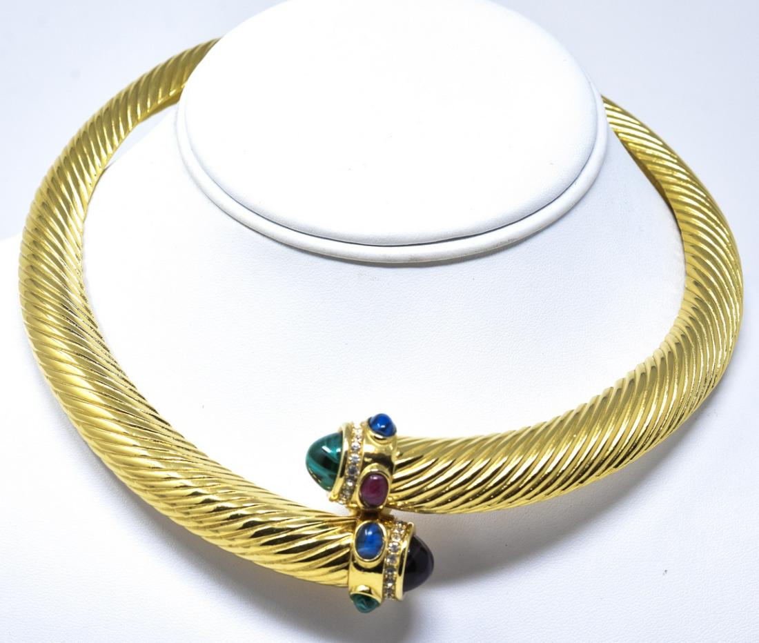 Vintage French Givenchy Torque Form Necklace: Vintage French Givenchy Torque Form Necklace. Hinged at back and clasped at the center front. Gilt metal, clear rhinestones, cabochons of faux rubies / emeralds and sapphires. Signed at clasp. Measure