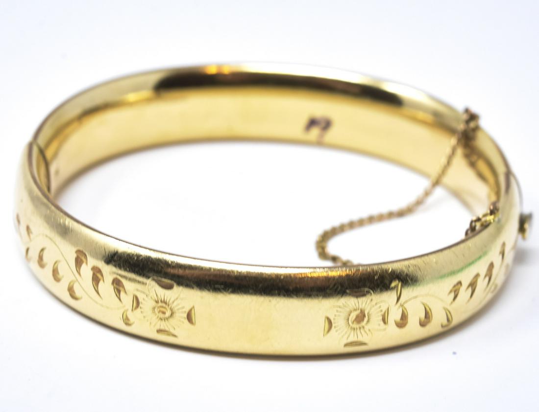 Vintage Gold Filled Floral Motif Bangle Bracelet: Vintage Gold Filled Floral Motif Bangle Bracelet w Safety Chain. Marked for Ballou gold filled. Hinged bangle bracelet. Weighs approximately 22.3 grams total. Measures approximately 2.5 inches across 