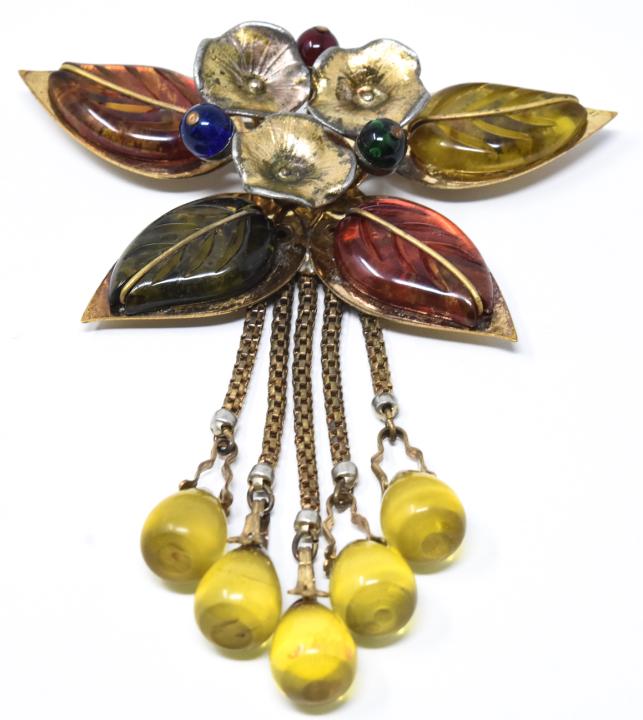 Vintage Elsa Schiaparelli Bakelite & Gilt Brooch: Vintage Elsa Schiaparelli Bakelite & Gilt Brooch. This piece is unsigned but identified as and attributed to Elsa Schiaparelli. Gilt metal, carved bakelite, bakelite beads, glass beads. Floral motif w