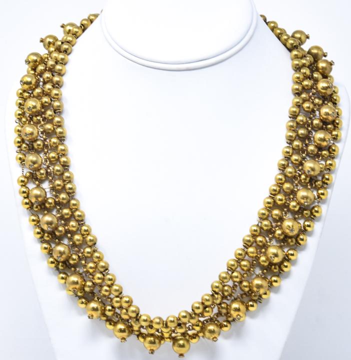Vintage C 1945 Miriam Haskell Gilt Necklace: Vintage C 1945 Miriam Haskell Gilt Necklace w Paste Accents. Articulated / wire metal with beads. Unsigned but identified as / attributed to Miriam Haskell. Measures approximately 22 inches in length.