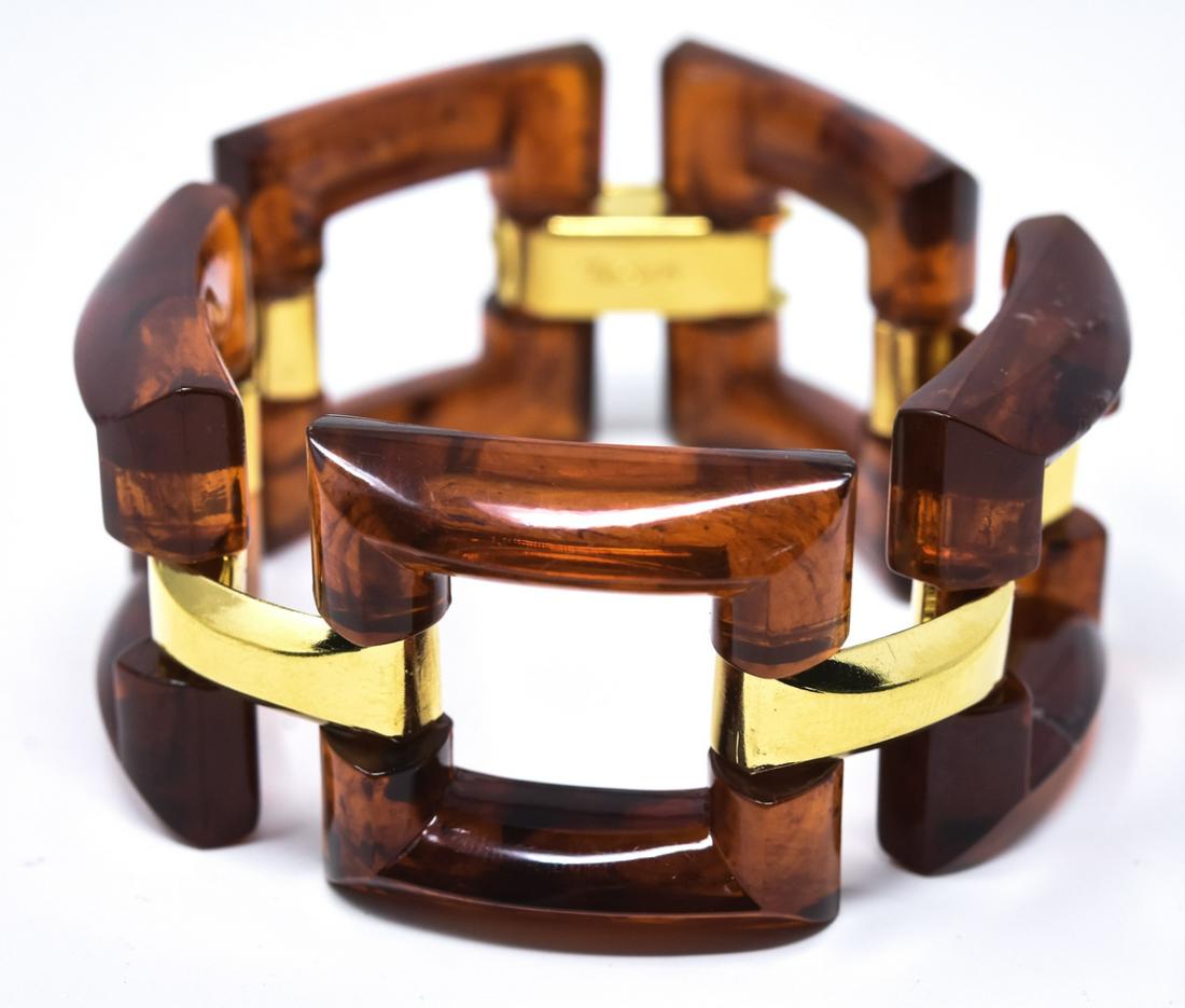 Vintage C 1970s Crown Trifari Faux Amber Bracelet: Vintage C 1970s Crown Trifari Faux Amber Bracelet. Signed. Gilt metal and open panel faux amber links. Measures 7.5 inches in length.