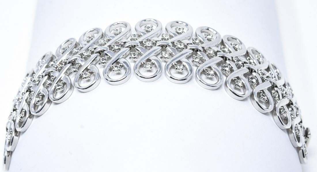 Vintage Crown Trifari Paste Rhodium Plate Bracelet: Vintage Crown Trifari Paste & Rhodium Plate Bracelet. Signed. Articulated openwork panel bracelet. Measures 7.5 inches in length.