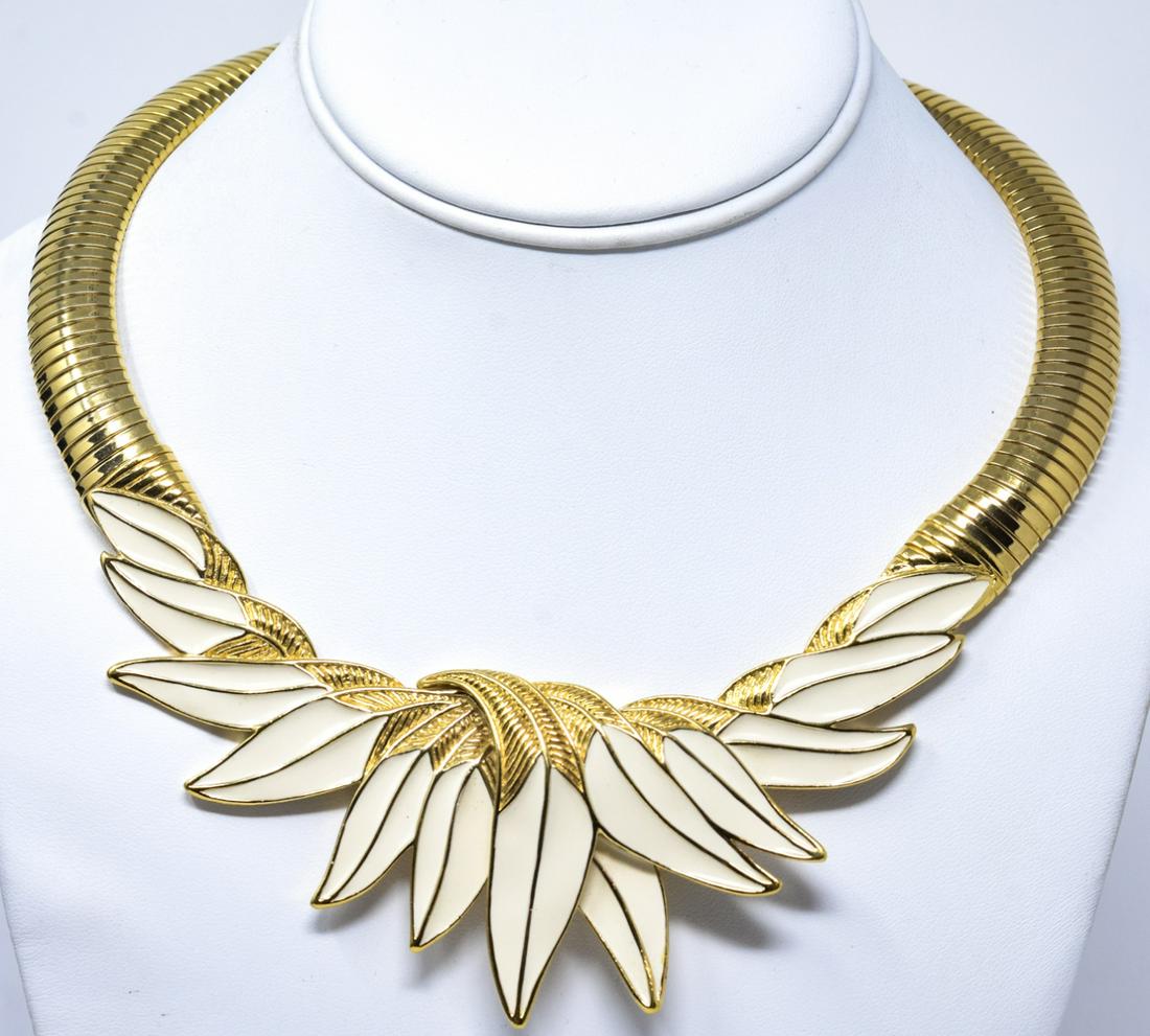 Vintage Gilt Metal & Enamel Trifari Necklace: Vintage Gilt Metal & Enamel Trifari Necklace. Signed. Articulated necklace with gilt and enamel center piece in leaf motif. Measures approximately 18.5 inches in length.