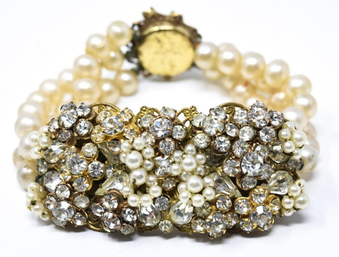 Miriam Haskell Style Faux Pearl & Paste Bracelet: Miriam Haskell Style Faux Pearl & Paste Bracelet. Unsigned. Three strands of faux pearls, central plaque and clasp set with rhinestones. Measures 6.5 inches in length.