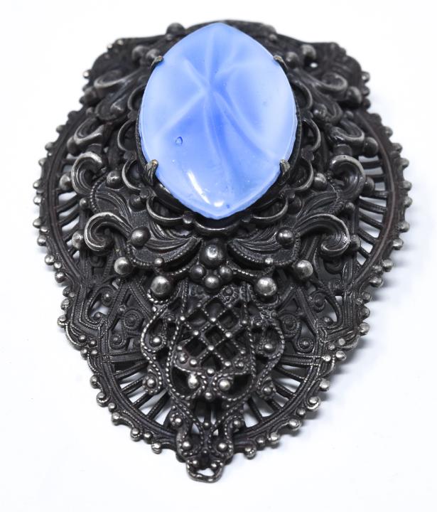 Vintage Costume Jewelry Brooch by Style Metal Spec: Vintage Costume Jewelry Brooch by Style Metal Spec NY. Filigree setting with navette form glass panel. Measures 2.5 inches in length.