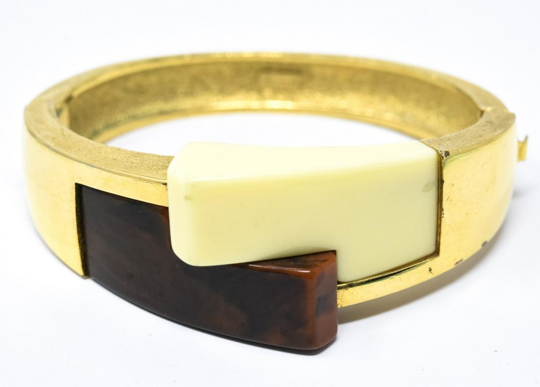 Vintage Crown Trifari Gilt Acrylic Bypass Bracelet: Vintage Crown Trifari Gilt & Two Tone Acrylic Bypass Bracelet. Signed. Measures just over 2.25 inches across interior opening.