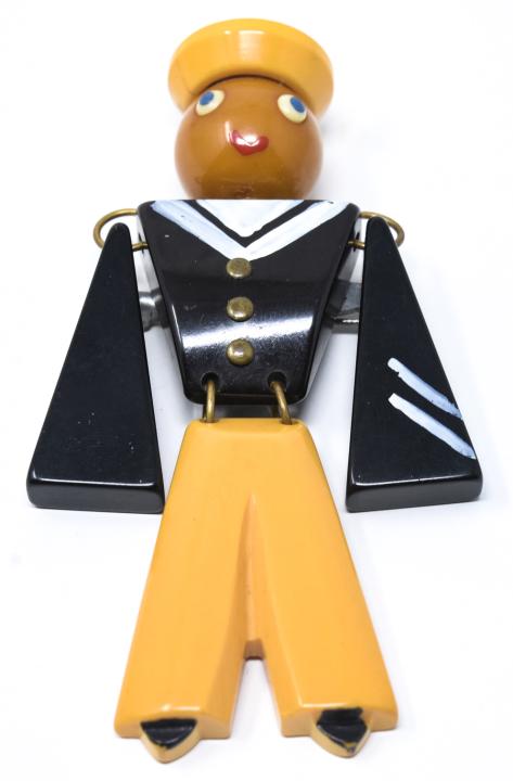 Vintage C 1945 Articulated Bakelite Sailor Brooch: Vintage C 1945 Articulated Bakelite Sailor Brooch. Carved and hand painted bakelite brooch. Measures 3.5 inches in length.