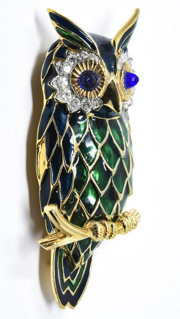 Vintage C 1970s Jomaz Gilt & Enamel Owl Brooch: Vintage C 1970s Jomaz Gilt & Enamel Owl Brooch. Signed. Having sapphire color cabochon rhinestone eyes and clear rhinestone halos. Measures 2.75 inches in length.