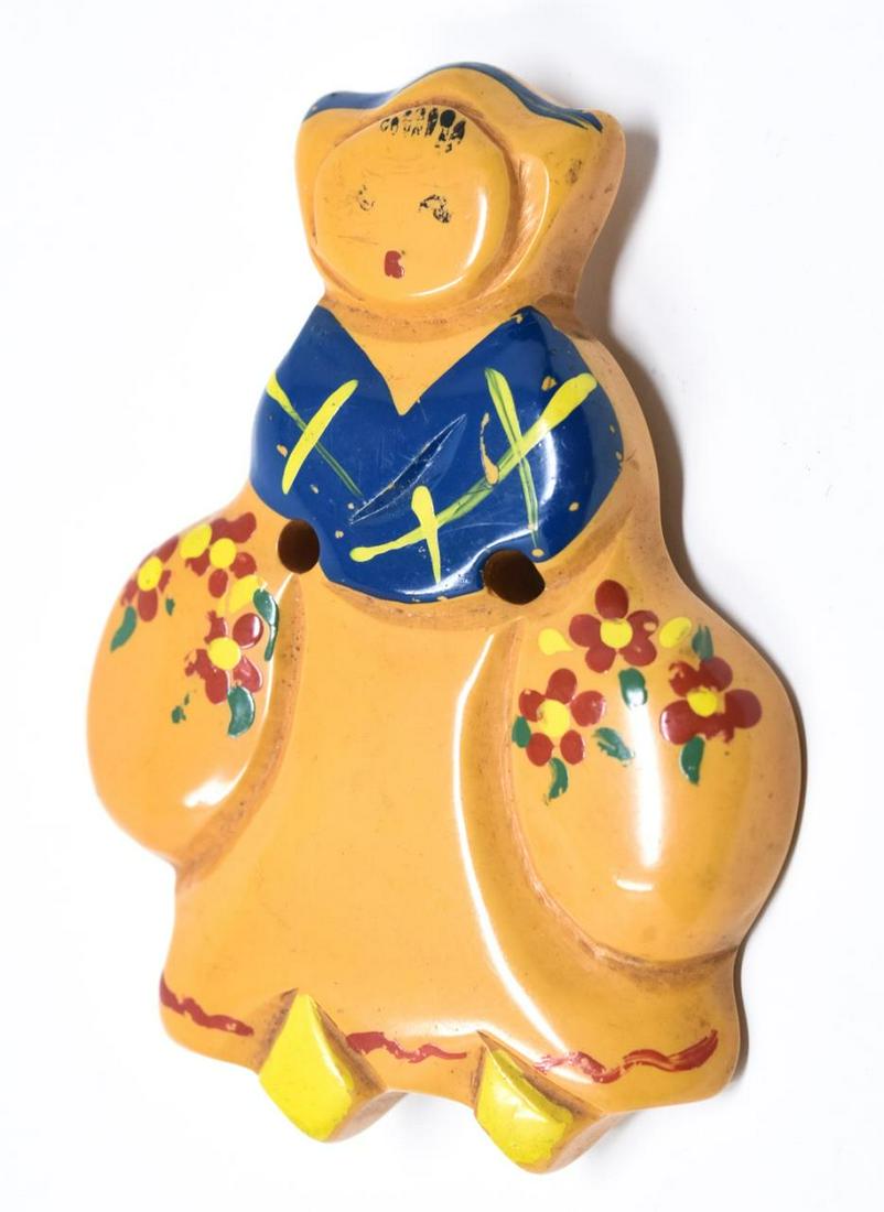 Vintage C 1940 Carved Bakelite Milk Maid Brooch: Vintage C 1940 Carved Bakelite Milk Maid Brooch. Carved and hand painted. Measures 2.5 inches in length.