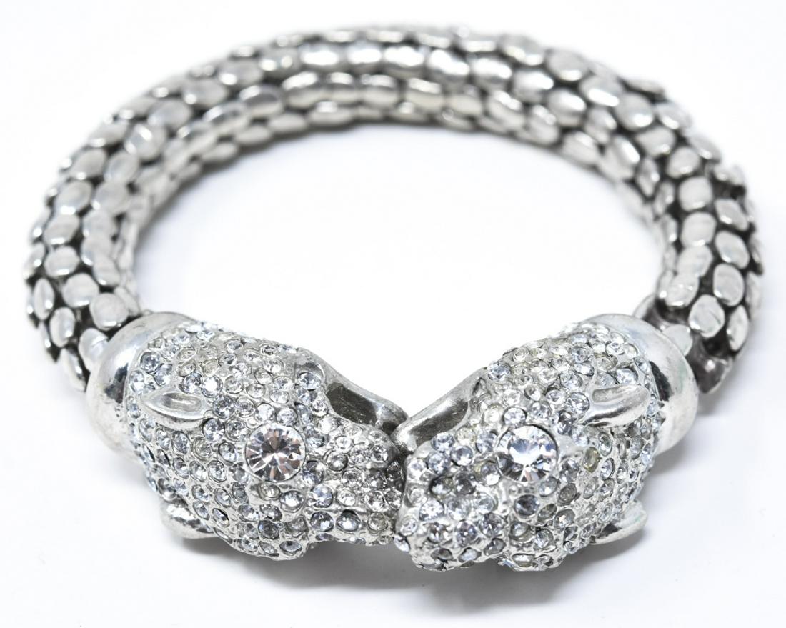 Silver Tone & Paste Panther Motif Bypass Bracelet: Silver Tone & Paste Panther Motif Bypass Bracelet. Measures 2.25 inches across interior opening, slightly adjustable in size.