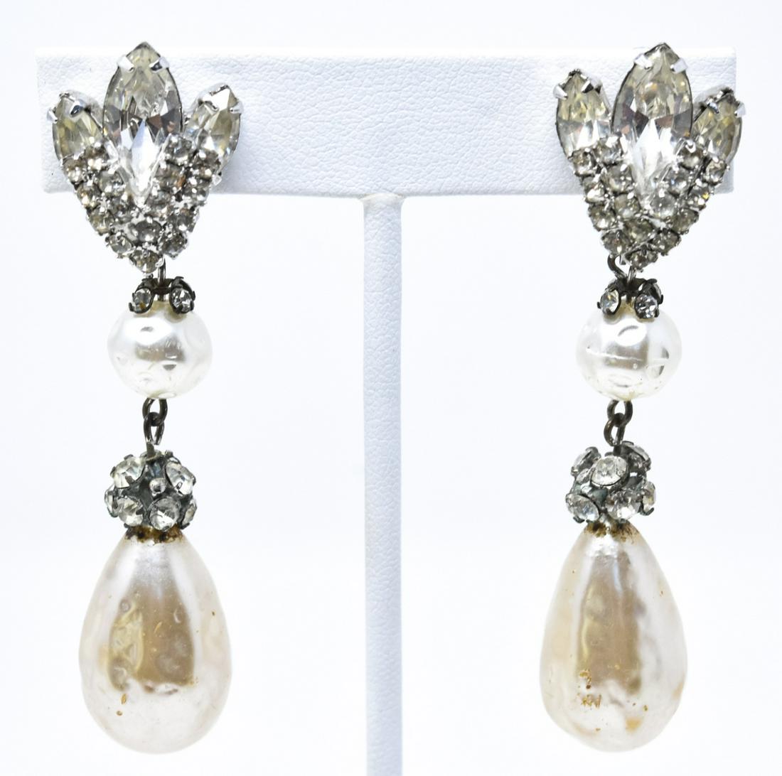 Vintage Vendome Rhodium Plated Clip on Earrings: Vintage Vendome Rhodium Plated Clip on Earrings w Navette Rhinestones & Faux Baroque Pearls. Each measures 2.75 inches in length.