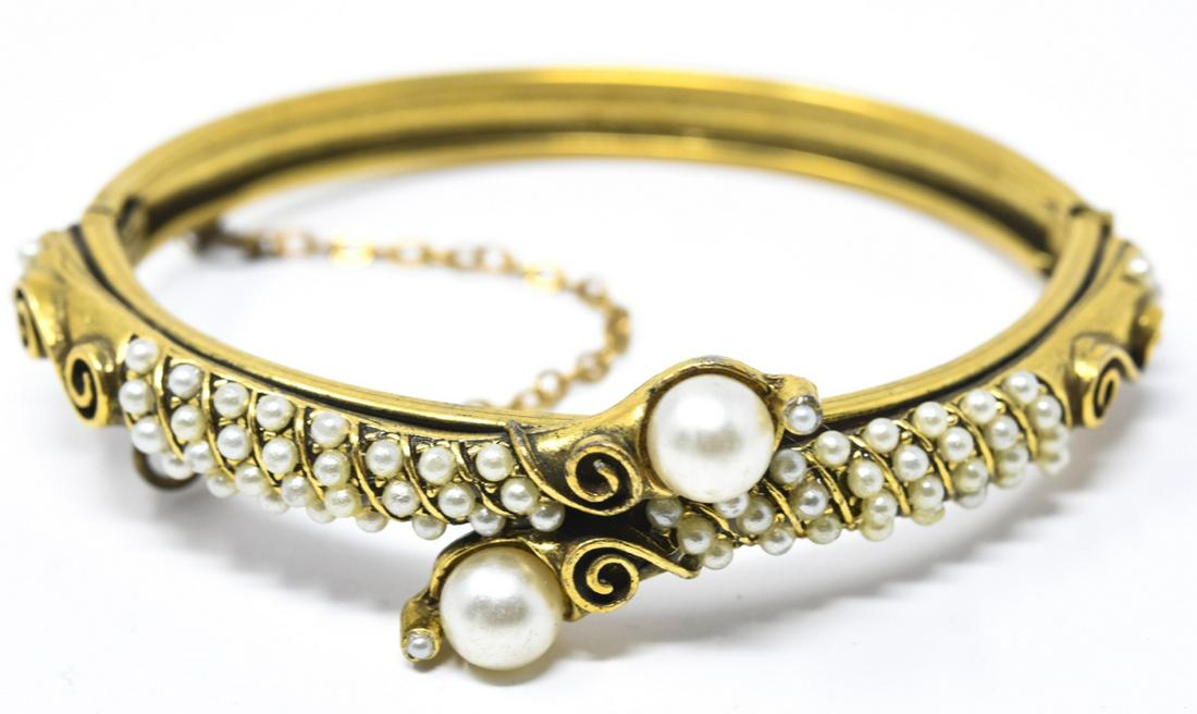 Vintage Florenza Victorian Style Bangle Bracelet: Vintage Florenza Victorian Style Bangle Bracelet. Hinged bangle bracelet with safety chain and faux pearls. Signed. Measures 2.25 inches across interior opening.