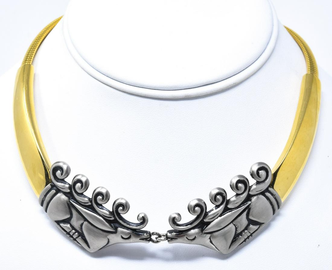 Vintage French Givenchy C 1977 Reindeer Necklace: Vintage French Givenchy C 1977 Reindeer Necklace. Gilt metal and silver tone with pair of kissing reindeer. Signed. Measures 15 inches in length.