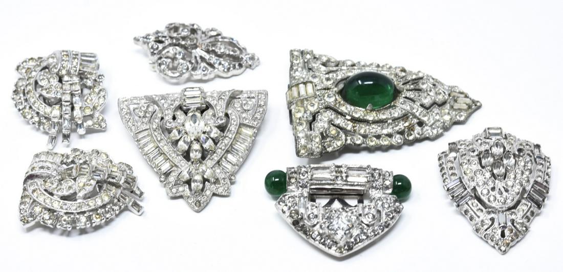 Collection of Antique Art Deco Paste Set Clips: Collection of Antique Art Deco Paste Set Clips / Brooches. Art Deco era 1920-30s. With clear and green paste stones. Largest measures just over 2 inches in length.