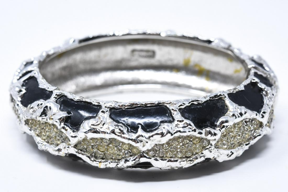 Vintage C 1970s Jomaz Enamel & Rhinestone Bracelet: Vintage C 1970s Jomaz Enamel & Rhinestone Bracelet. Hinged bangle bracelet in silver tone with black enamel and clear rhinestones. Signed. Measures nearly 2.5 inches across interior opening.