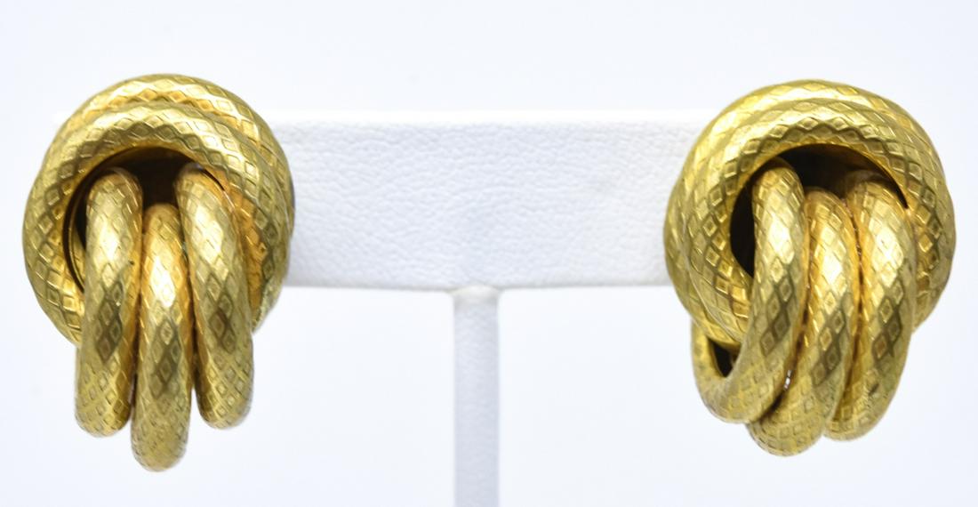 Vintage C 1970s Miriam Haskell Clip on Earrings: Vintage C 1970s Miriam Haskell Clip on Knot Form Earrings. Signed. Each with six entwined rings and measures 1 inch in length.