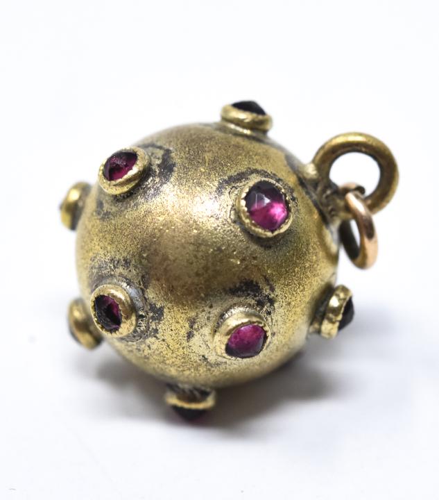 Antique 19th C Rose Cut Garnet Fob Pendant: Antique 19th C Rose Cut Garnet Fob Pendant. Set with rose cut ruby paste or little red garnets. Acid tests at 10kt, may be gold filled. Measures 1/2 an inch in diameter, plus bail.