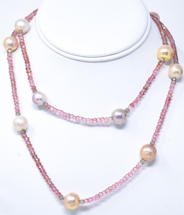 Tahitian Pearl & Rose Quartz Necklace: Tahitian Pearl and Rose Quartz Necklace – With a silver tone clasp. Approximately 32” long. Retail price $350 Unsold stock used for display from a prominent Westchester jewelry shop.