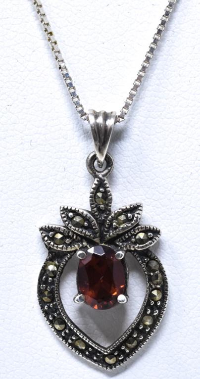 Vintage Sterling Silver Marcasite Garnet Necklace: Vintage Sterling Silver Marcasite Garnet Necklace. Necklace chain measures18 inches in length. Chain is hallmarked for sterling and Italy.
