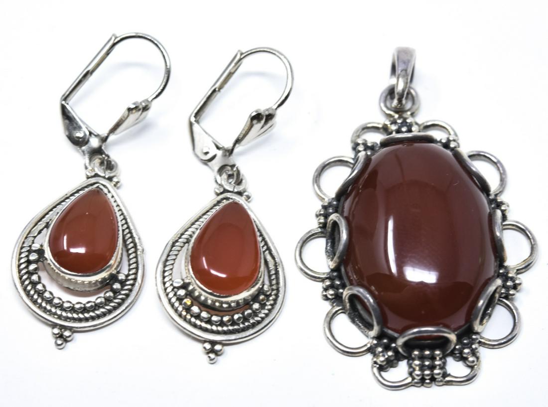 Hand Made Sterling & Carnelian Pendant & Earrings: Hand Made Sterling & Carnelian Pendant & Earrings. Sterling silver and carnelian pendant and earrings. Pendant measures 1 3/4 inches in length.