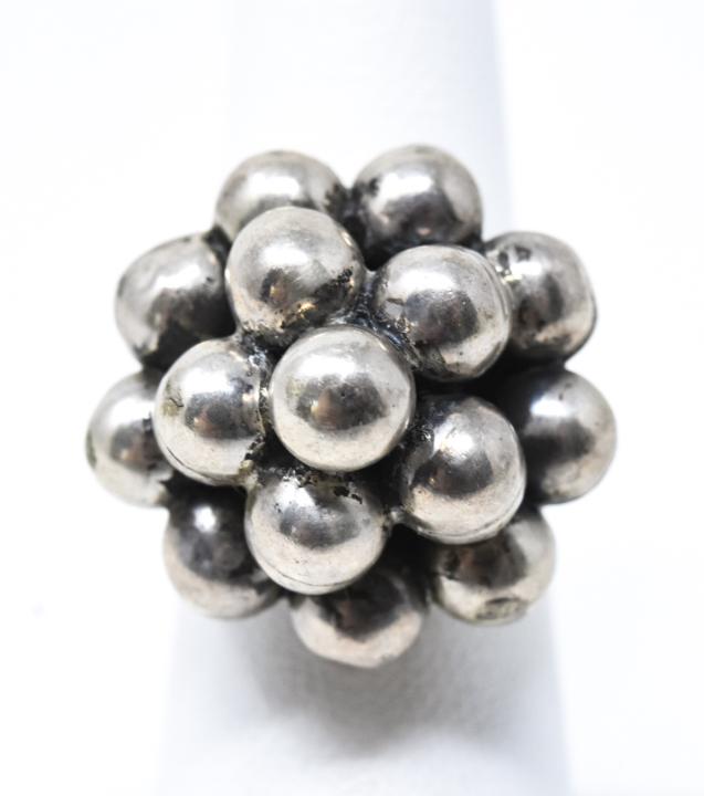 Vintage Sterling Silver Wedding Cake Cluster Ring: Vintage Sterling Silver Wedding Cake Cluster Ring. Having a design of tiered spheres resembling a wedding cake. Ring size can be adjusted.