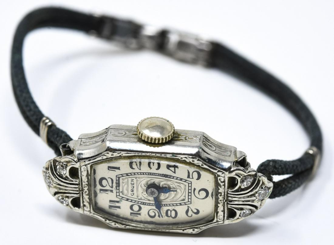 Antique 14kt Gold & Diamond Ladies Watch by Gruen: Antique 14kt Gold & Diamond Ladies Watch by Gruen On double cord bracelet. Signed on face, signed and hallmarked inside case. Set with six accent diamonds. Watch face / case measures just over 1 inch