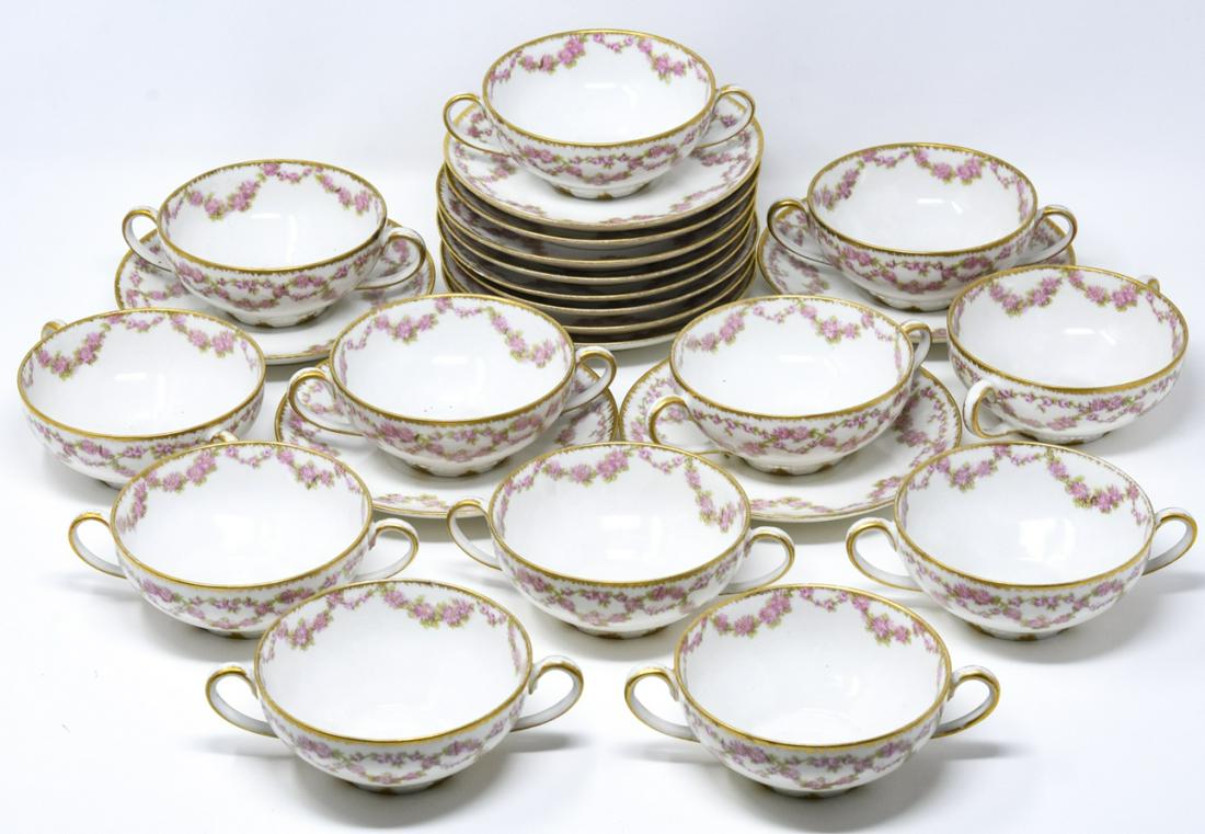 Antique GDA Limoges Soup Service for 12: Antique GDA Limoges Soup Service for 12. Limoges porcelain soup bowl service for 12, with floral wreath and gilt design. Marked on bottoms. Saucers measure 5.5 inches x in diameter.