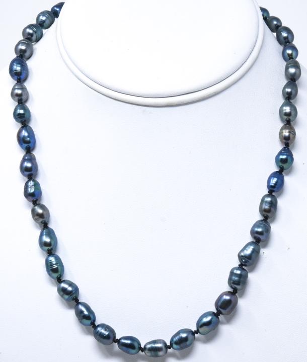 Hand Knotted Tahitian Baroque Pearl Necklace: Hand Knotted Tahitian Baroque Pearl Necklace Strand. Pearls vary in size from 6 mm to 9 mm. Tones of black, gray, silver. Measures 19 inches in length.