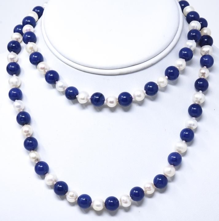 Baroque Pearl & Lapis Lazuli 30 Inch Necklace: Baroque Pearl & Lapis Lazuli 30 Inch Necklace. Hand knotted on white silk thread. Pearls are approximately 6mm in diameter. Measures 30 inches in length.