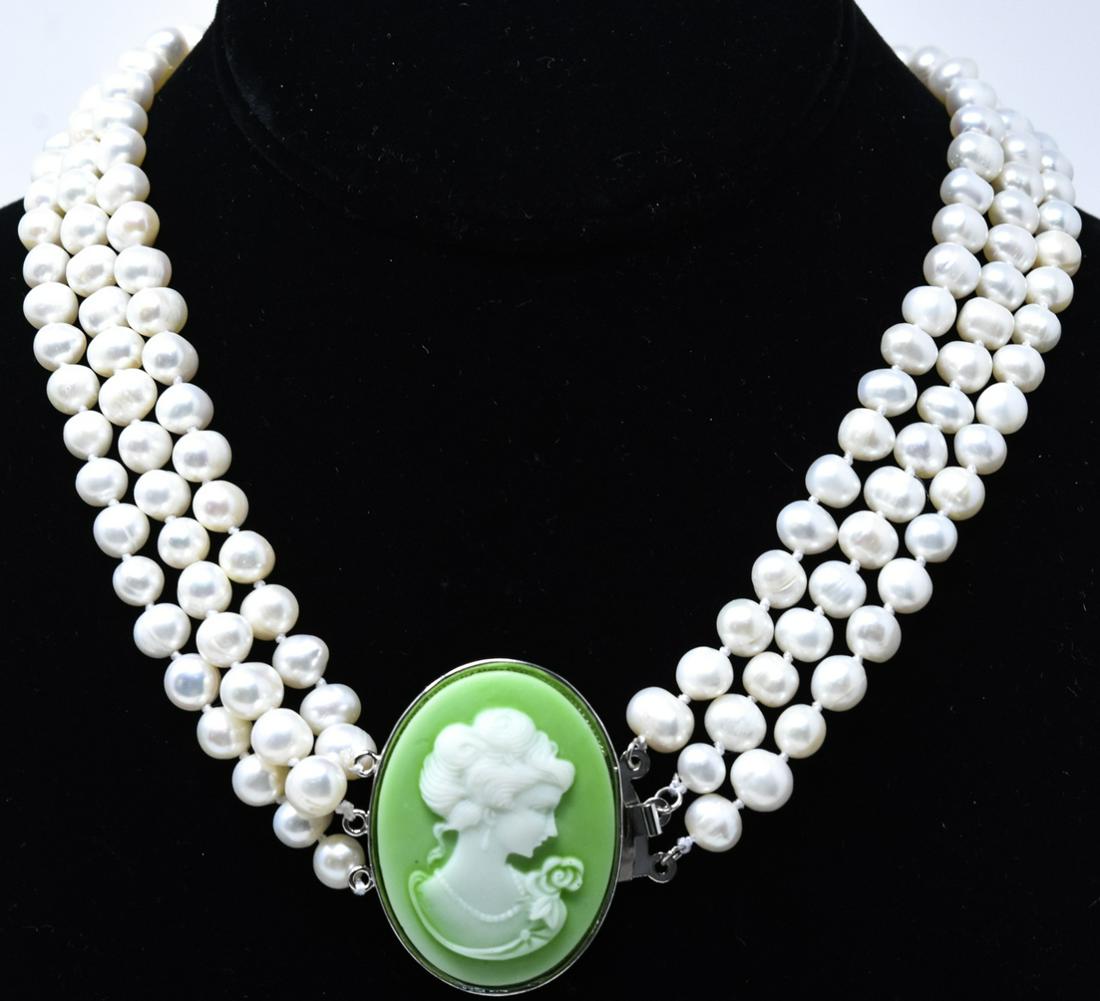 Three Strand Baroque Pearl & Cameo Necklace: Three Strand Baroque Pearl & Cameo Necklace. Hand knotted on white silk thread. Measures 17.25 inches in length.