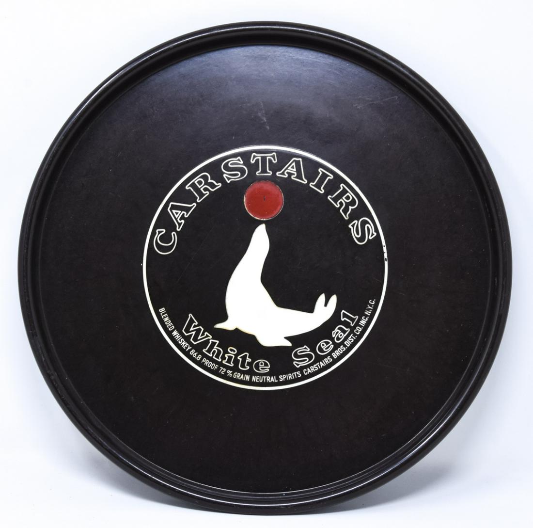 Art Deco Bakelite Carstairs White Seal Whisky Tray: Art Deco Bakelite Carstairs White Seal Whisky Tray. Bakelite advertising tray for Carstairs White Seal Whisky. Measures 11.5 inches in diameter.