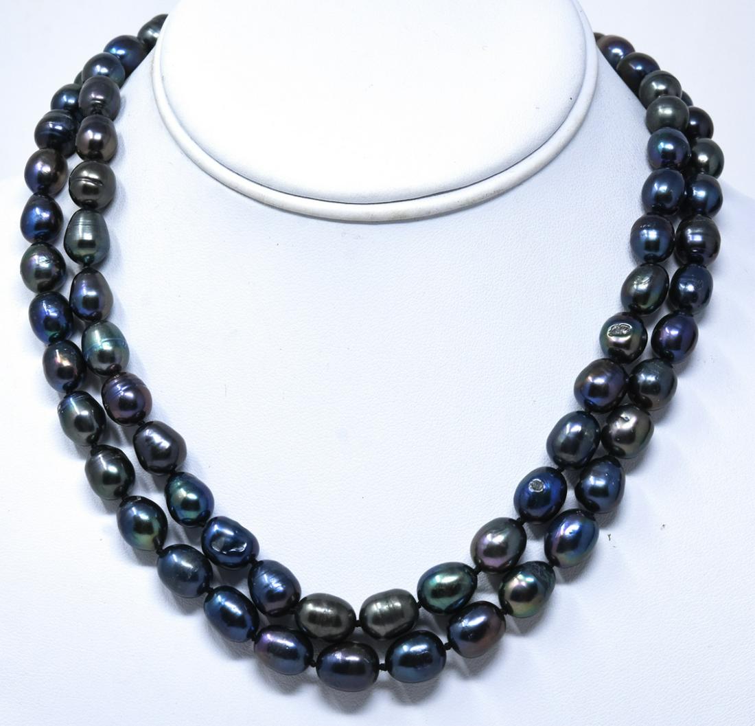 Pair Hand Knotted Baroque Tahitian Pearl Necklaces: Pair Hand Knotted Baroque Tahitian Pearl Necklaces. Hand knotted on black silk thread. High luster iridescent tones of black, gray, silver. Each measures 18 inches in length.