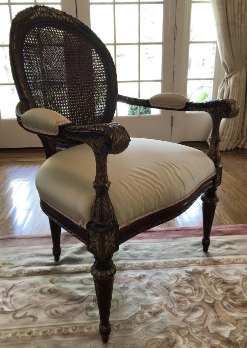Louis XVI Carved & Caned Upholstered Bergere Chair: Louis XVI Carved & Caned Custom Upholstered Bergere Chair. Heavily carved with double caned chair back, custom upholstered in silk with silk trim. Gilt carved accents. 42 inches x 27 inches x 28 inche