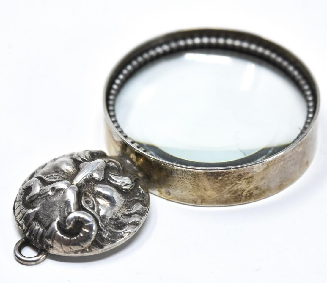 Vincent Simone Sterling Devil Magnifier Pendant: Vincent Simone Sterling Devil Magnifier Pendant. Sterling devil motif magnifier pendant signed Vincent Simone and hallmarked. Measures 2 inches x 1.25 inches.