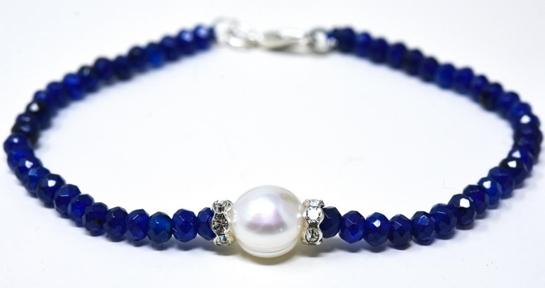 Faceted Blue Sapphire & Baroque Pearl Bracelet: Faceted Blue Sapphire & Baroque Pearl Bracelet. Having approximately 20 carats of faceted blue sapphire beads and one 8 mm oblong pearl. Beads test as sapphire on the presidium, may be treated or enha