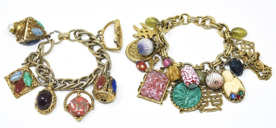 2 Chunky Gold Tone Charm Bracelets w Asian Charms: 2 Chunky Gold Tone Charm Bracelets Loaded w Large Asian Mixed Material Charms. Approximately 8 inches in length.