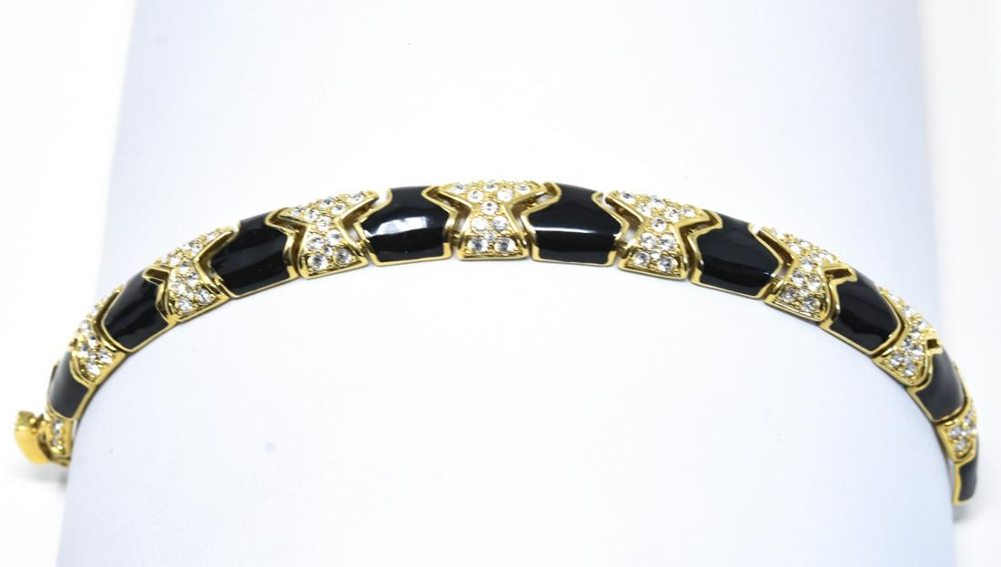 Kenneth Lane Enamel Rhinestone Bracelet: Kenneth Lane Enamel Rhinestone Bracelet. Gold tone with black enamel and clear rhinestones. Measures 7.5 inches.
