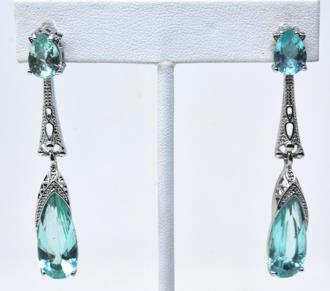 Pair of Edwardian Style Emerald Paste Earrings: Pair of Edwardian Style Emerald Paste Earrings. Articulated at center. Pear shaped stones. Each measures 2.25 inches in length.