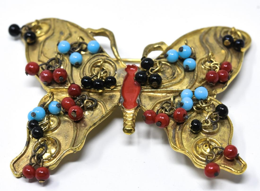 Hattie Carnegie 1960s Gilt Butterfly Pin / Brooch: Hattie Carnegie 1960s Gilt Butterfly Pin / Brooch. Gilt butterfly and red enamel torso with red, black and turquoise bead cluster accents. Signed on back. Measures 2.5 inches x 3 inches.