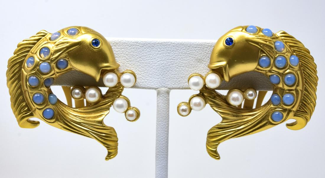 Pair Elizabeth Taylor for Avon Gilt Fish Earrings: Pair Elizabeth Taylor for Avon Gilt Fish Earrings. Clip earrings with moonstone cabs, blue paste eyes and faux pearl bubbles. Each measures 1.5 inches. Signed on back.