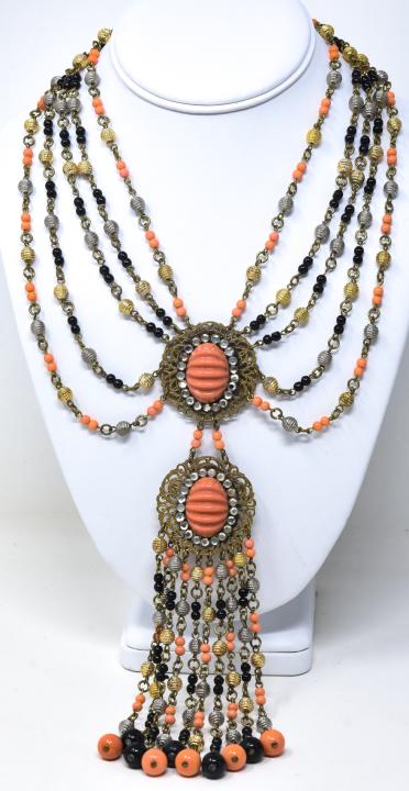 Givenchy 1970s Double Filigree Pendant Necklace: Givenchy 1970s Double Filigree Pendant Necklace. Signed with older Givenchy tag. Double filigree pendants with coral melon cut cabochons, graduated chain and fringe of coral, black, gold and silver be