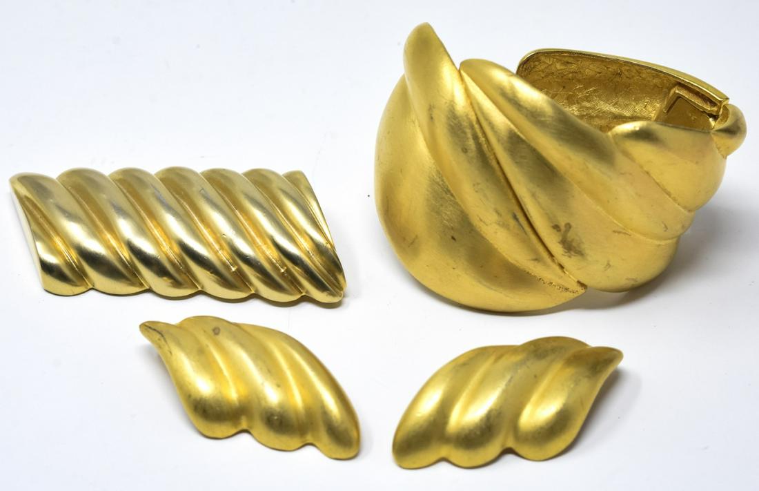 Les Bernard C 1980s Cuff Earrings & Brooch Set: Les Bernard C 1980s Cuff Earrings & Brooch Set. Wide spring cuff, brooch and earclips in gilt metal modernist design. Brooch measures 3 inches in width.