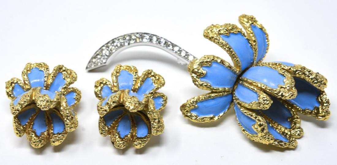 Jomaz 3D Flower Pin & Pair Clip Earrings Set: Jomaz 3D Flower Pin & Pair Clip Earrings Set. Brooch with blue enamel and pave clear paste stones in gilt metal with pair of matching clip earrings. Signed. Brooch measures 2 7/8 inches, earrings meas